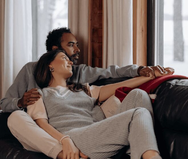 Couple relaxing on a cozy sofa