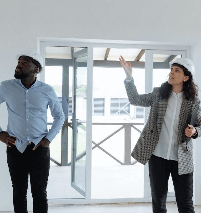 Engineers reviewing architectural project together