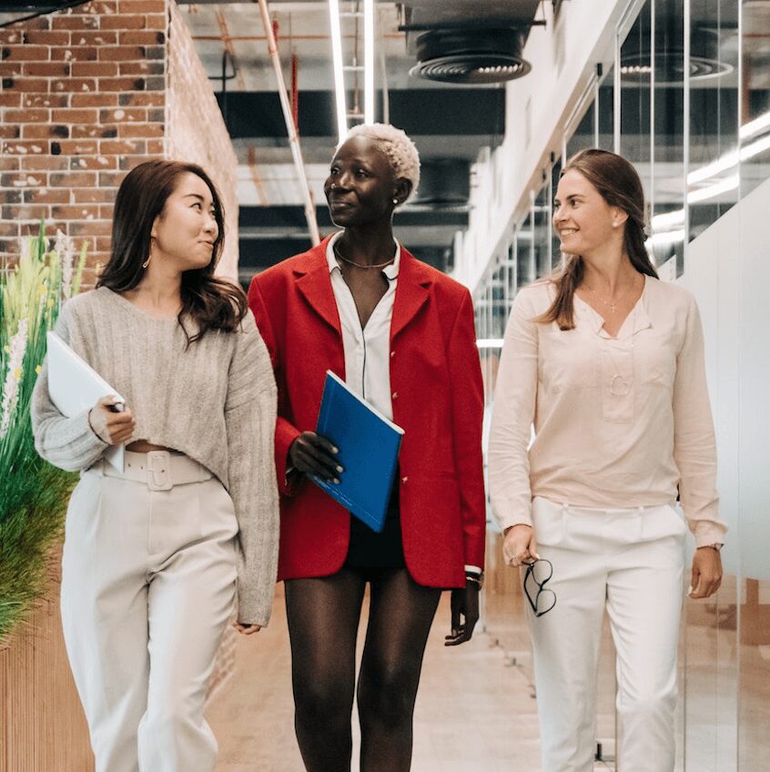 Diverse team walking and talking