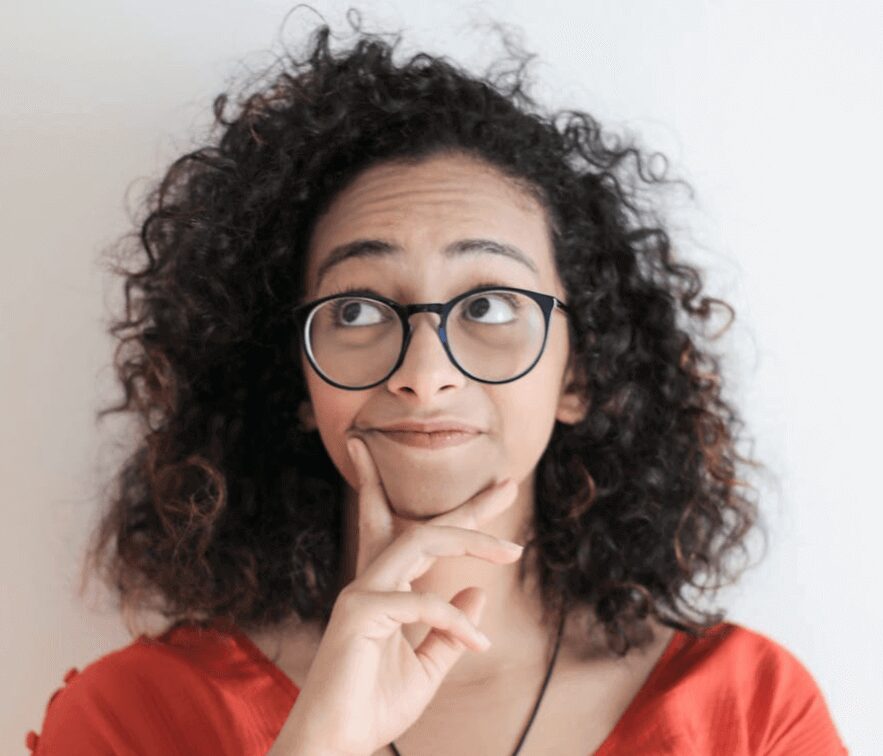 Thoughtful expression on a curly-haired person