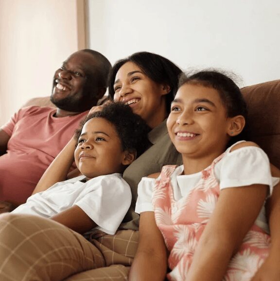 Parents and children sitting indoors