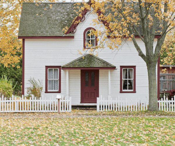 Charming cottage surrounded by fall foliage