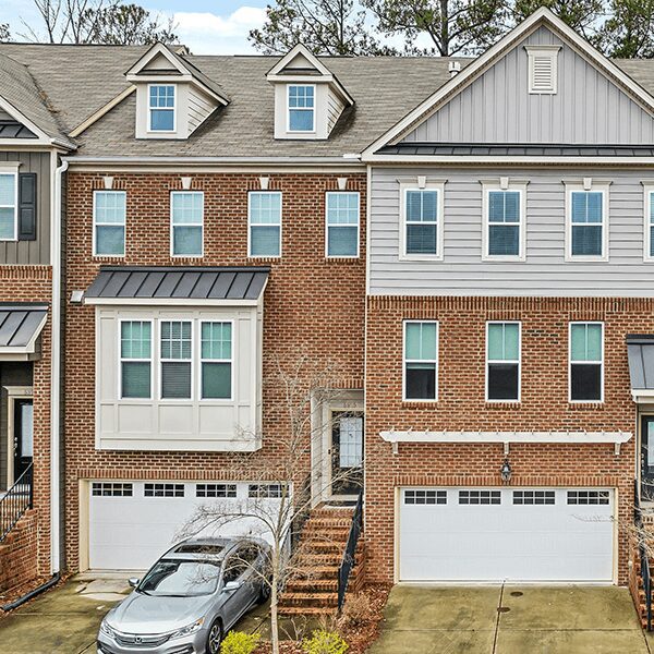 Residential homes with driveway and car