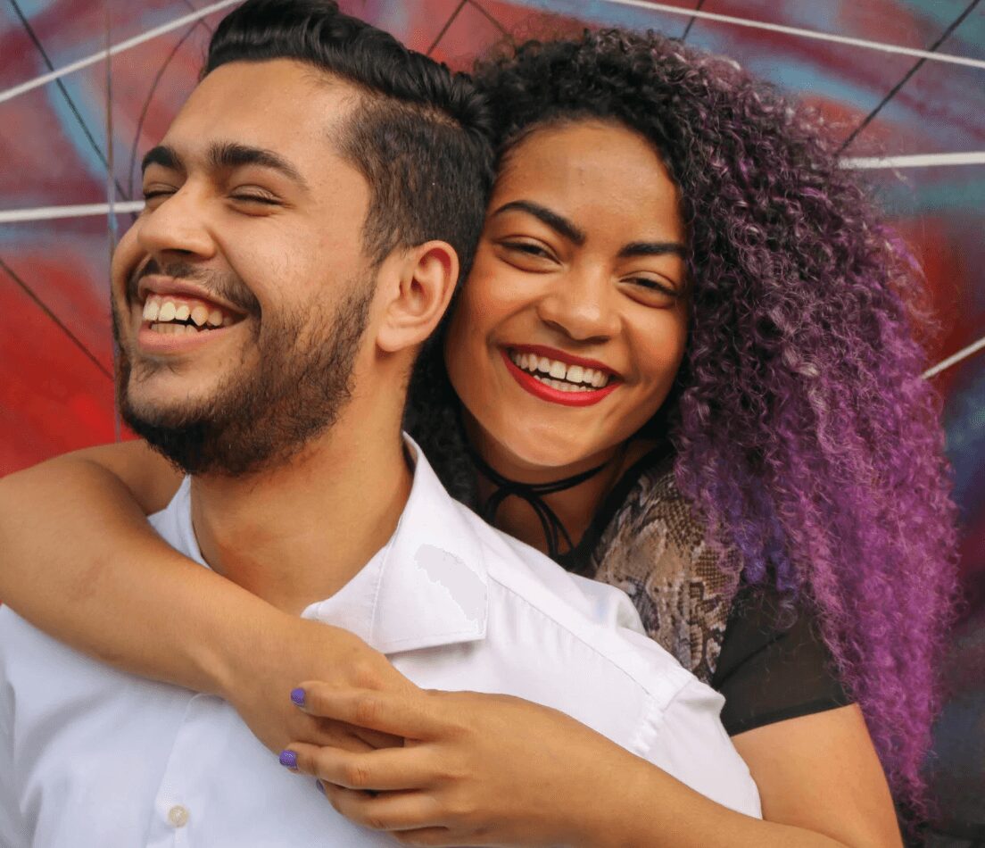 Happy couple embracing and laughing