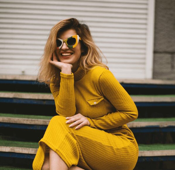 Woman in yellow dress with sunglasses