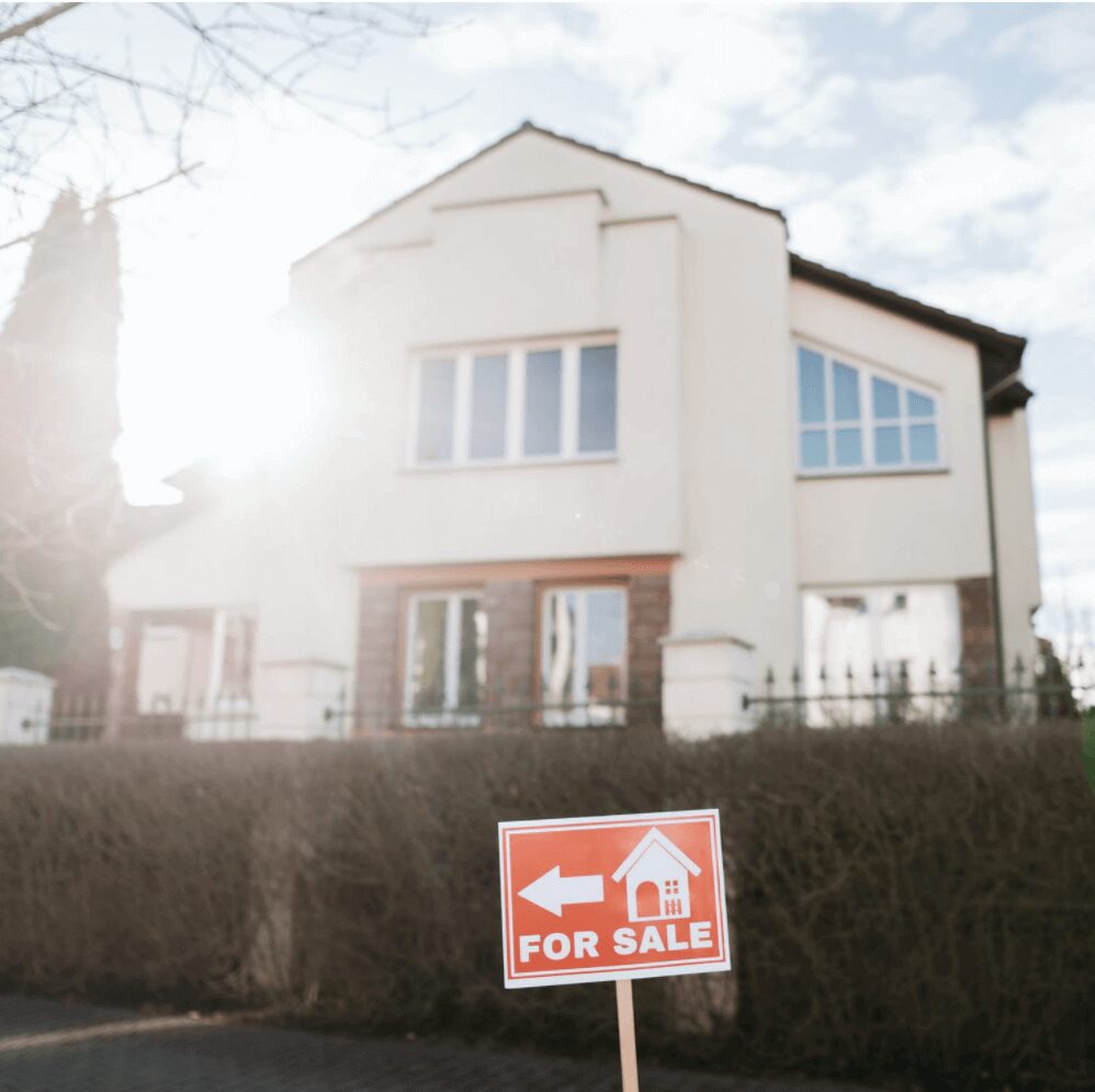 Real estate property with for sale sign