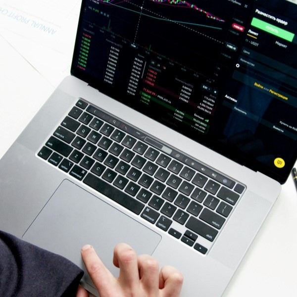 Laptop displaying financial trading charts