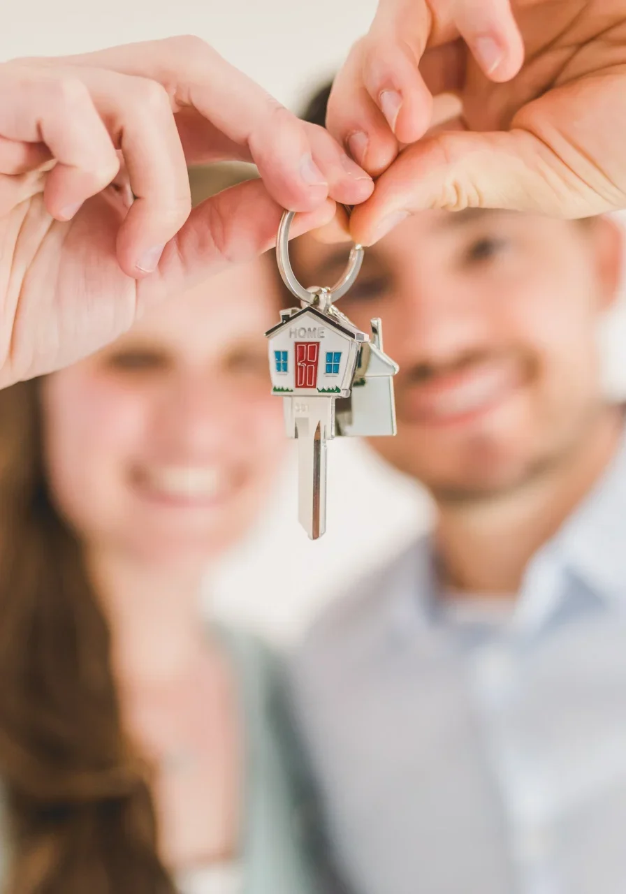 Happy couple with new home keys